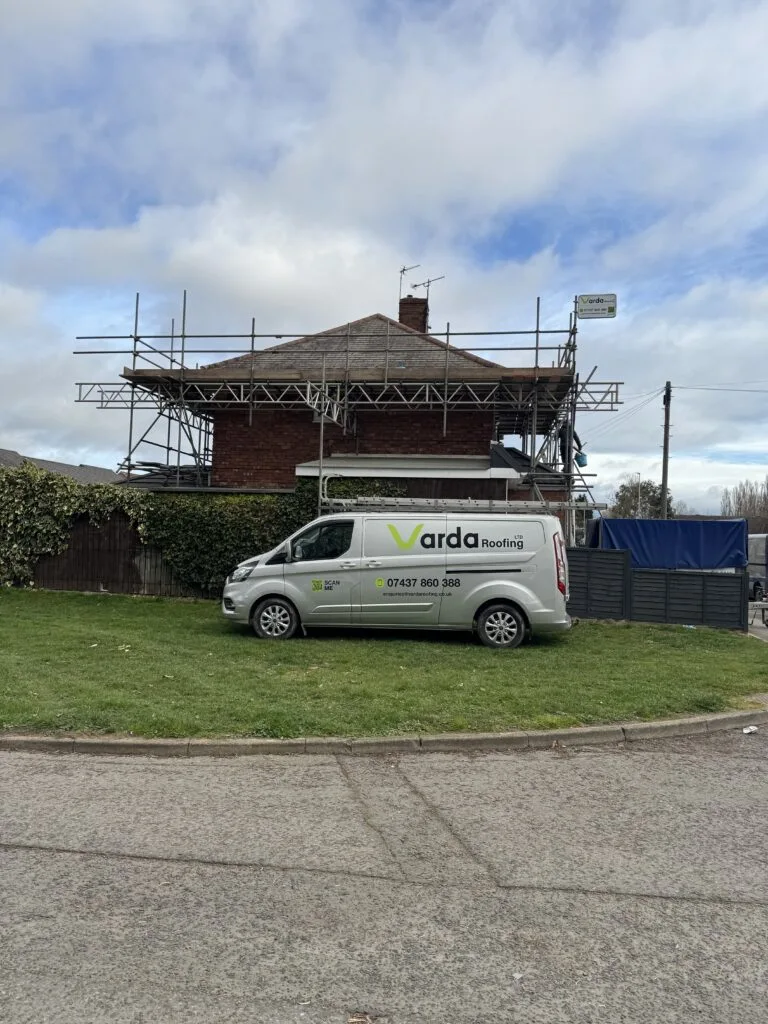 Varda roofing van in front of Darlington Home with recent re-roof
